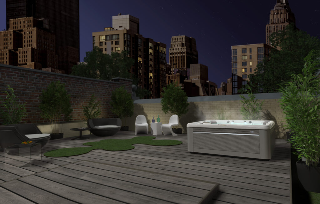 Caldera Paradise Series spa on a city deck at night